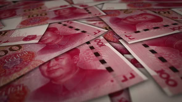 China Yuan 100 banknote flying over money surface