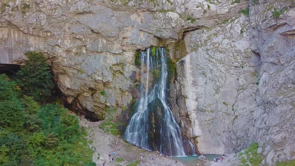 Waterfall Gega - Flows From the Rock. Summer, Green Trees , Cascade. Shooting From a Drone