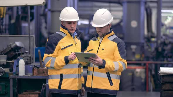 Two Engineers at an Industrial Plant