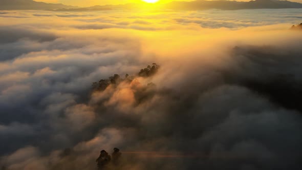 Time lapse Aerial view of drone. Scene of sunrise cloud movements in morning sky.A sea of fog is fo