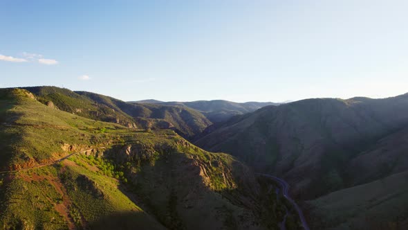 Aerial Footage Of Beautiful Mountain Valley And Hills During Beautiful Warm Golden Hour Sunset.