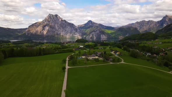 Beautiful view on the Mountains, lake and a Village Drone Video