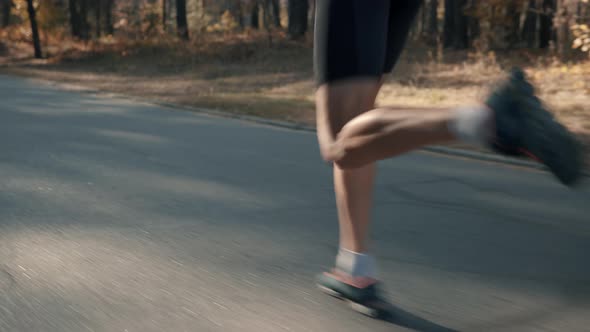 Runner Silhouette In Sportswear Preparing To Triathlon And Sprinting In Fall Park. Triathlete Jog.