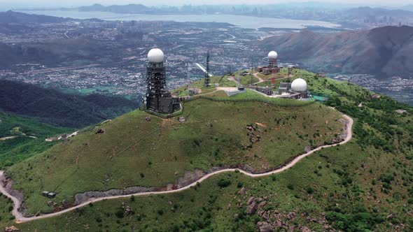 Aerial view of Sun rising at the tallest mountain Tai Mo Shan in Hong Kong with colorful blue sea an