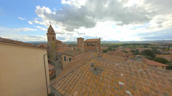 View Of Bell Tower Of Church Of San Cristoforo In Bettolle, Sinalunga - low aerial drone