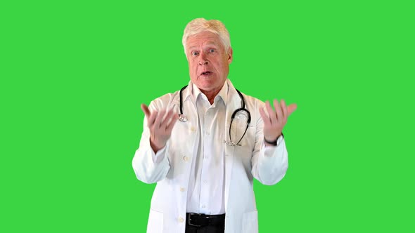 Elderly Male Doctor Arguing on Camera on a Green Screen Chroma Key