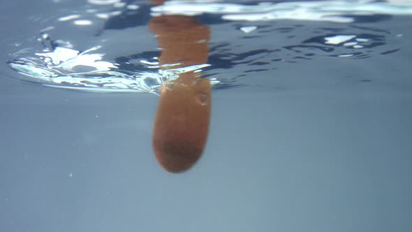 a Wooden Spoon Immerced in Water and Mix It