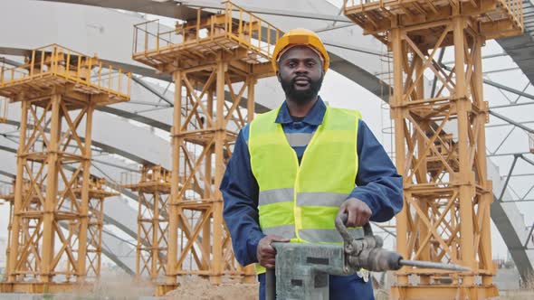 Portrait of Black Male Construction Worker with Jackhammer