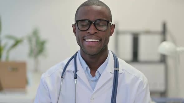 Portrait of Smiling African Doctor in Clinic