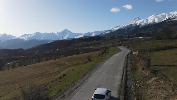 Caring next to the mountains in Europe. Drone shot of Georgia peaks, Cavkaz.