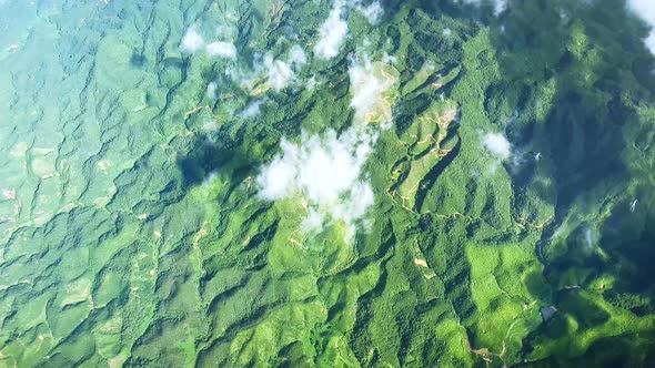 View of the Mountain Range with White Clouds and a Plane Engine