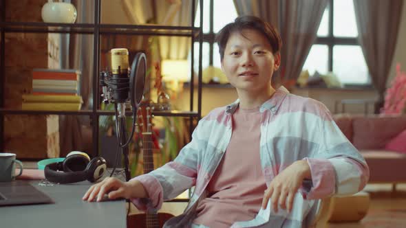 Portrait of Asian Woman at Home Recording Studio