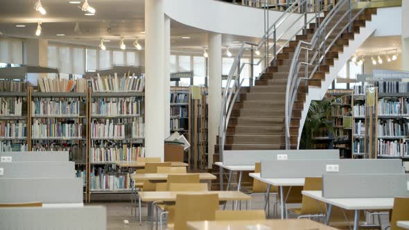 Interior of Library with Books on Shelves and Stairs