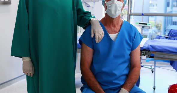 Portrait of surgeons wearing surgical mask in operation theater