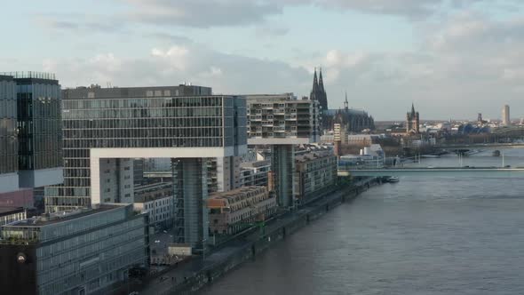 AERIAL: Cologne Futuristic Kranhaus, Crane House Apartments, Office Buildings in Beautiful Sunlight