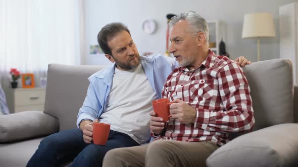 Father and Son Having Coffee Together, Remembering Pleasant Moments, Family