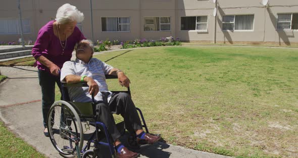 Senior couple enjoying the park of a retirement home