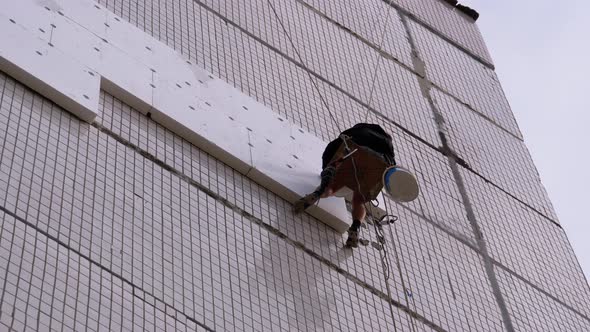 Industrial Climber Insulation of Facade Old High-Rise Building Using Styrofoam