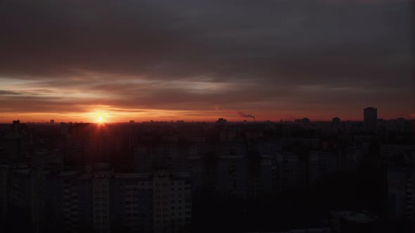 Top Panoramic View of Orange Sunrise on Skyline Over City Buildings