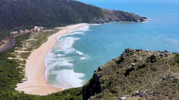 Aerial drone scene on mountains with deserted beach secret paradise with estuary lagoon emptying int