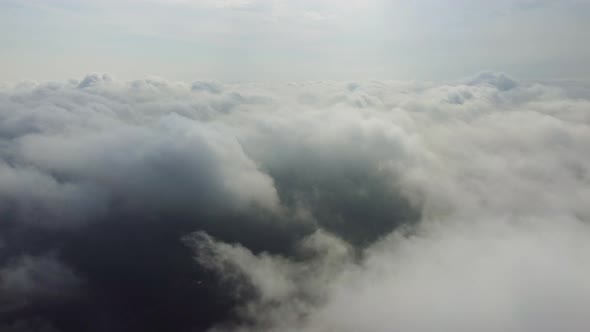 Aerial Perspective View of Flying Over Clouds