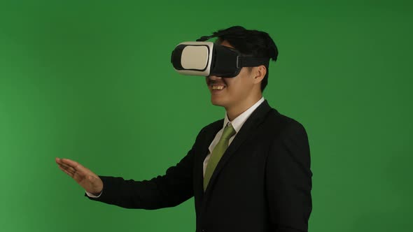 Asian Businessman Working In Virtual Reality