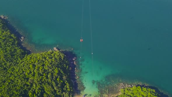 Drone View of Cable Cars Traveling and Crossing the Tropical Islands Blue Ocean