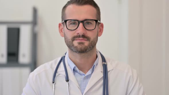 Portrait of Male Doctor Looking at the Camera