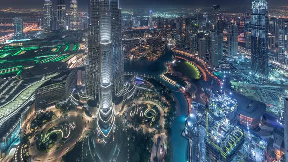 Paniramic Skyline View of Dubai Downtown with Mall Fountains and Burj Khalifa Aerial Night Timelapse