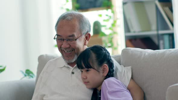 Happiness Elderly grandfather talking with grandchild together