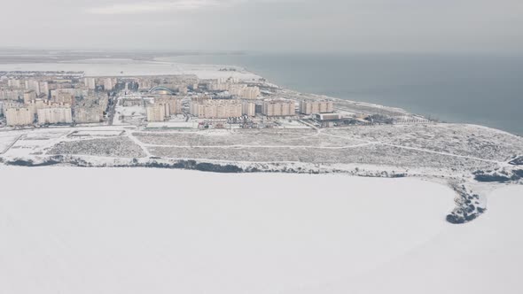 Aerial View of a Small Town on the Sea Coast on a Beautiful Winter Day