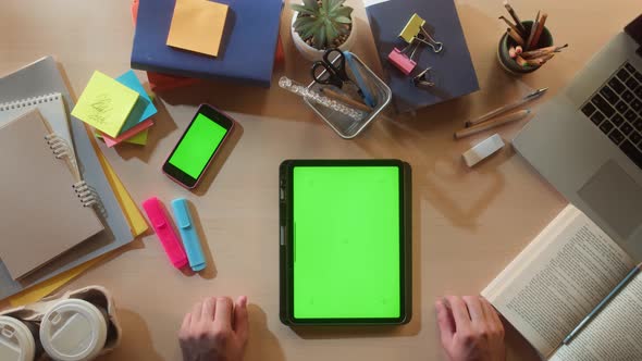 Student Using Gadget with Chroma Key Screen Top View