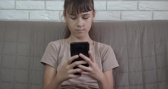 Teen Using Smartphone Device at Home