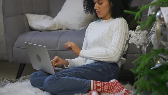 Portrait of African American Woman Working Remotely on Her Laptop