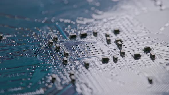 Computer Electronic Circuit Board with Radial Conductor Tracks and SMD Capacitors Rotating Macro