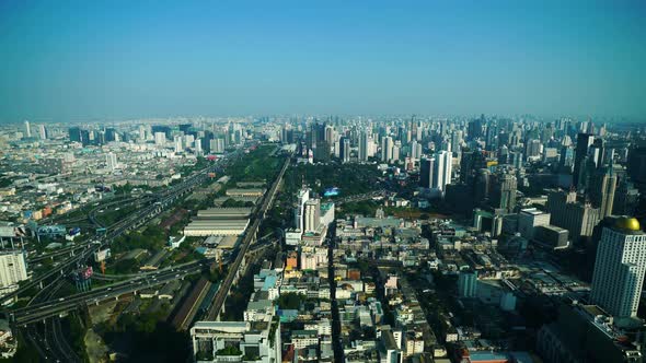 panning shot of Bangkok city downtown skyline and expressway road