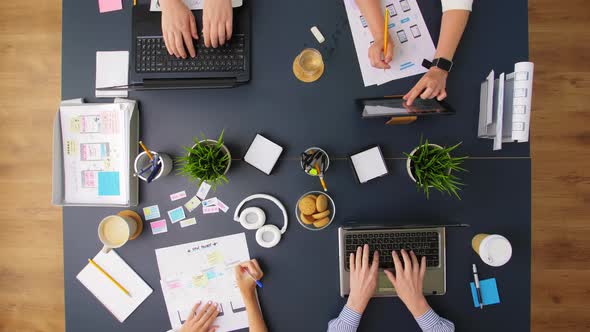Business Team with Gadgets Working at Office Table