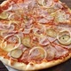 round pizza with mozzarella cheese, salami, cucumber and onion, rotating close-up - VideoHive Item for Sale