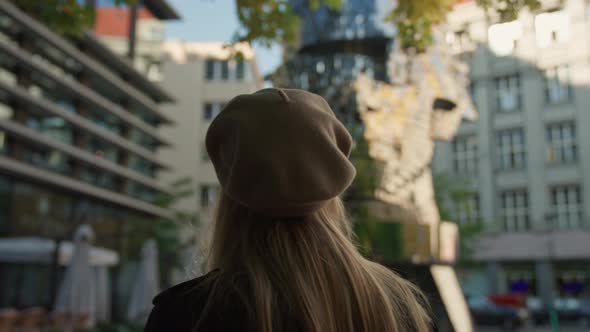 Woman In Beret Looking At Moving Sculpture In Prague