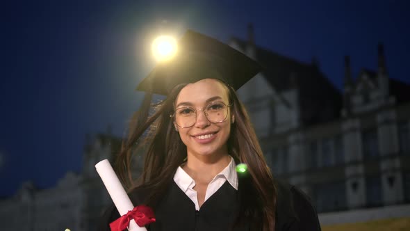 Happy Beautiful Young Female Graduate Smiling To Camera.