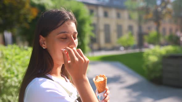 Beauty Young Happy Woman in Park Eating Ice Cream Enjoying Life Summer Holidays