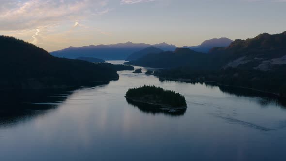 Beautiful sunset over the river and mountains of Canada - aerial