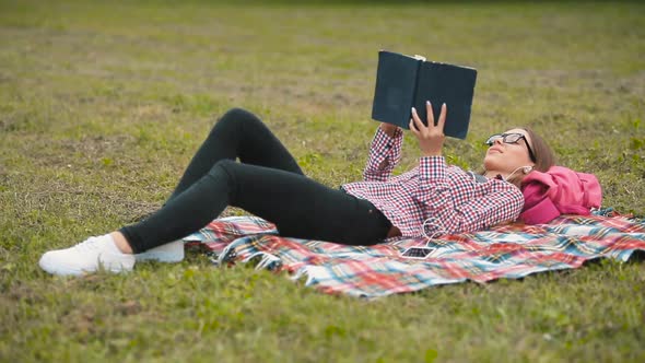 Student Reads Outdoors