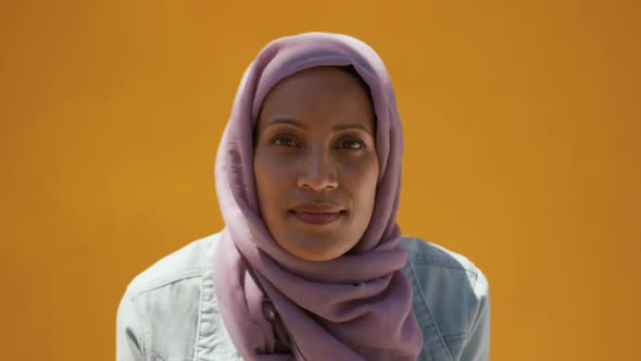 Young woman wearing hijab out and about in the city