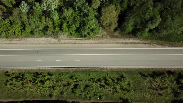 Top Down View of the Forest Road with Car