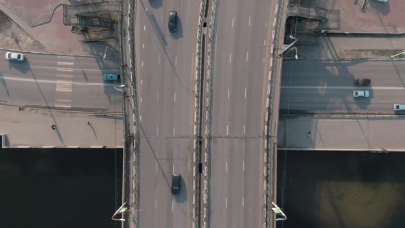  Aerial Top Down View of Traffic of Cars on the Bridge in a Populated City