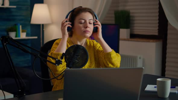 Blogger Streaming From Home Studio Putting Professional Headphones