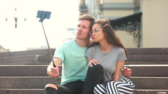 Young Trendy Couple Taking Selfie Outdoors
