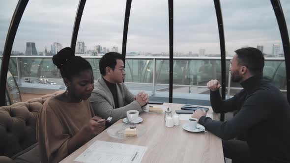 Friends Having Desserts on Rooftop