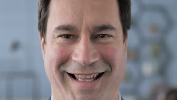 Close Up of Smiling Middle Aged Man Face